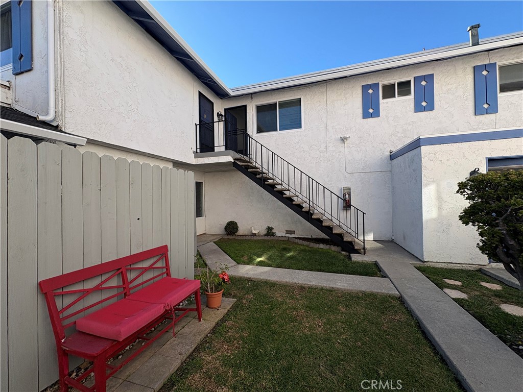 17061 Evergreen Circle, Unit D Huntington Beach, CA 92647 - Photo 13 of 18 a view of a house with backyard and sitting area