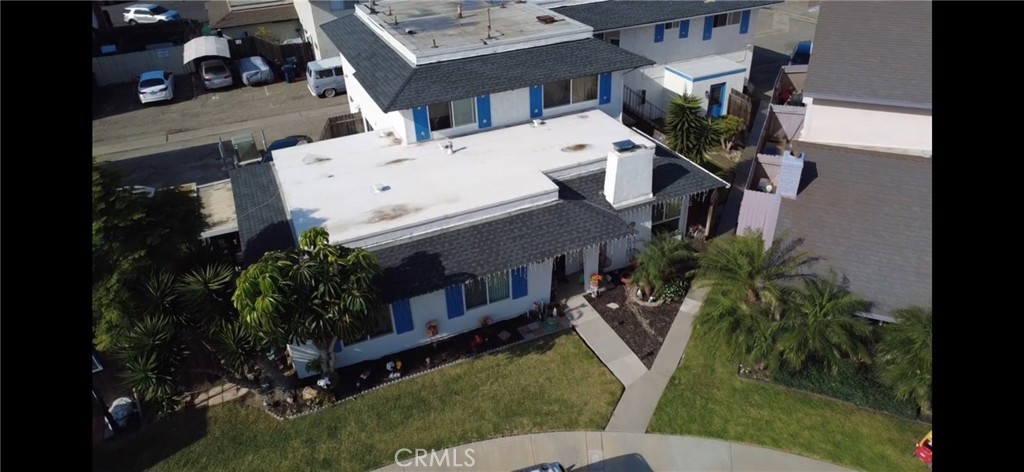 17061 Evergreen Circle, Unit D Huntington Beach, CA 92647 - Photo 14 of 18 a view of balcony with outdoor seating and plants