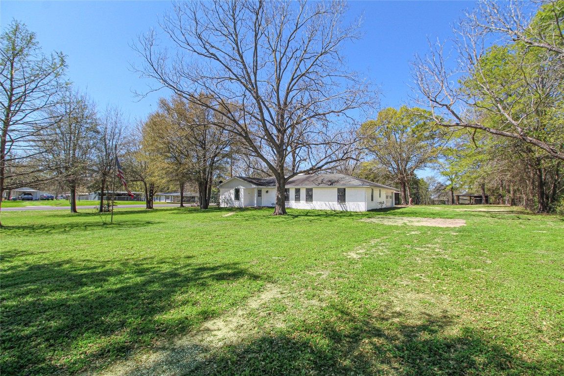 a view of a house with a big yard