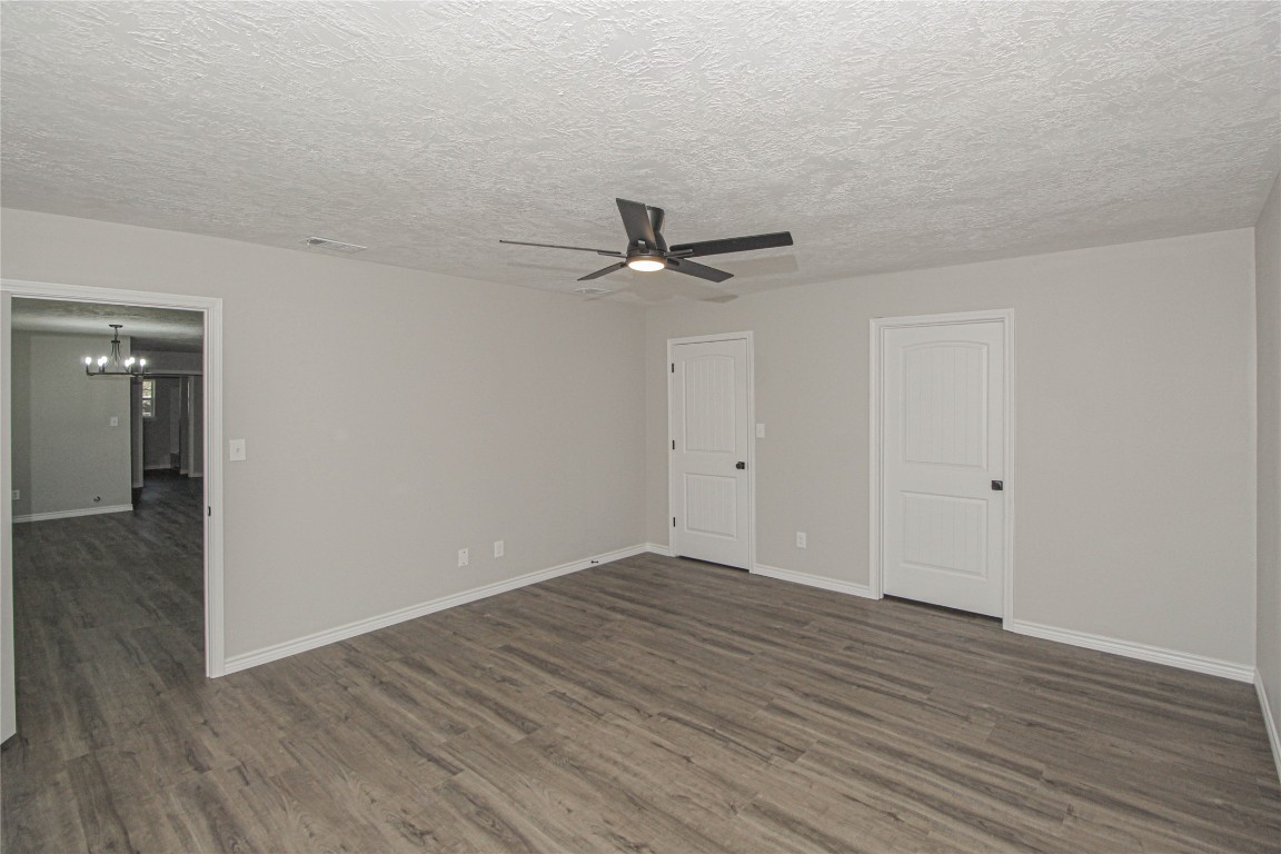 115 Corry Jones Livingston, TX 77351 - Photo 18 of 31 a view of an empty room with wooden floor