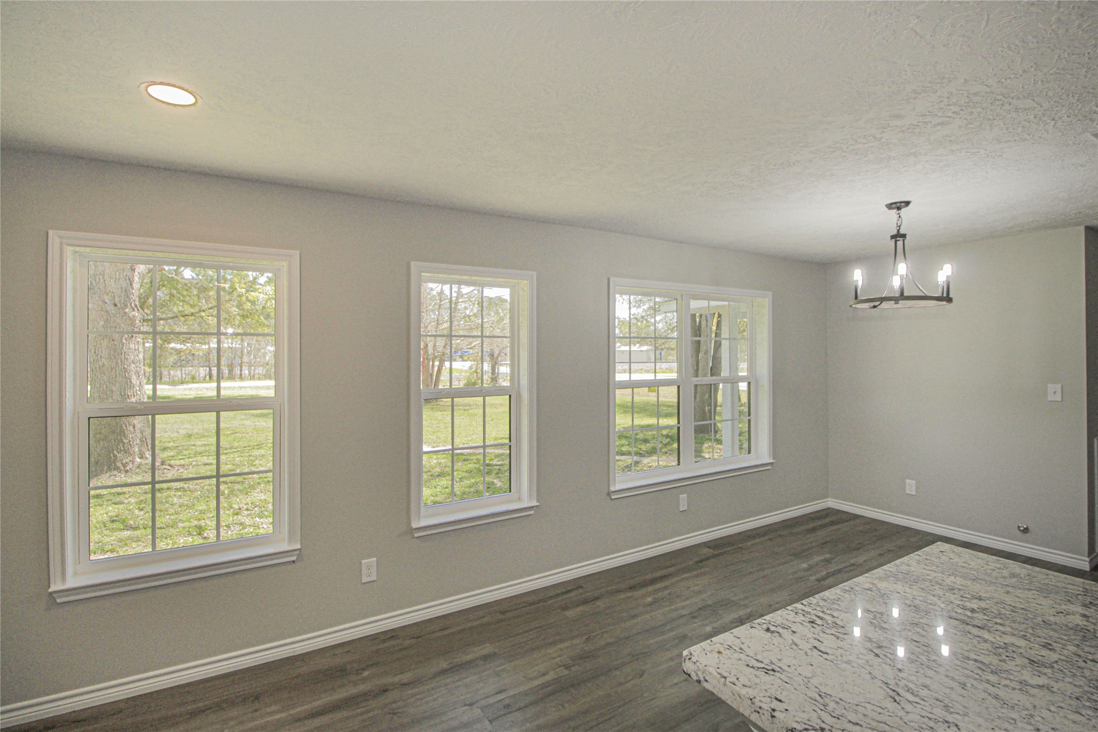 115 Corry Jones Livingston, TX 77351 - Photo 21 of 31 an empty room with wooden floor and windows