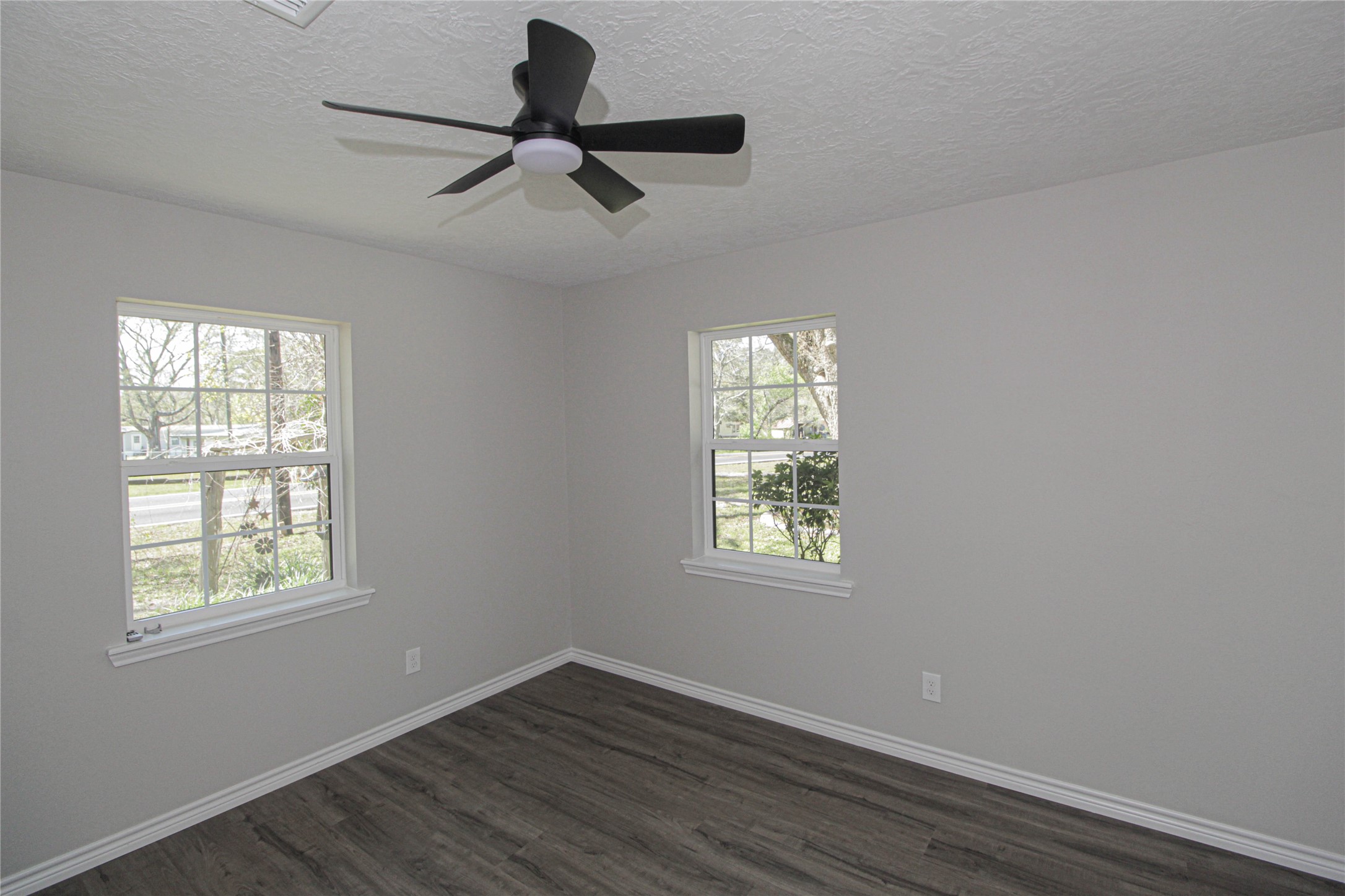 115 Corry Jones Livingston, TX 77351 - Photo 28 of 31 a view of a room with wooden floor and windows