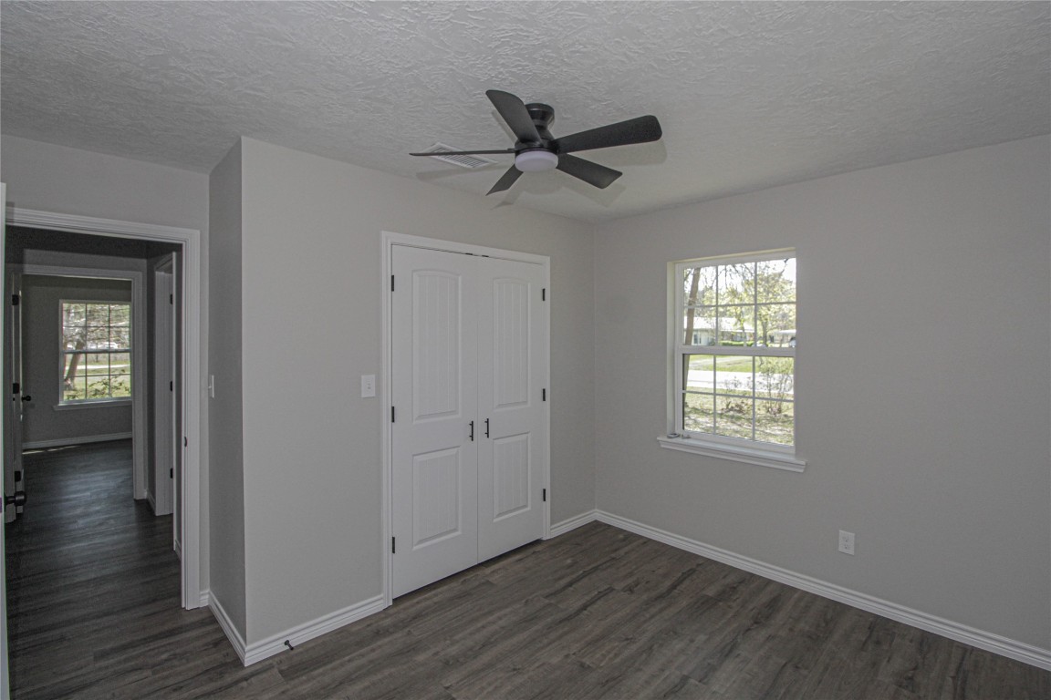 115 Corry Jones Livingston, TX 77351 - Photo 29 of 31 a view of an empty room with wooden floor and a window