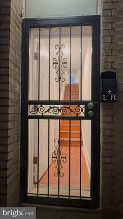 a view of a door and a window