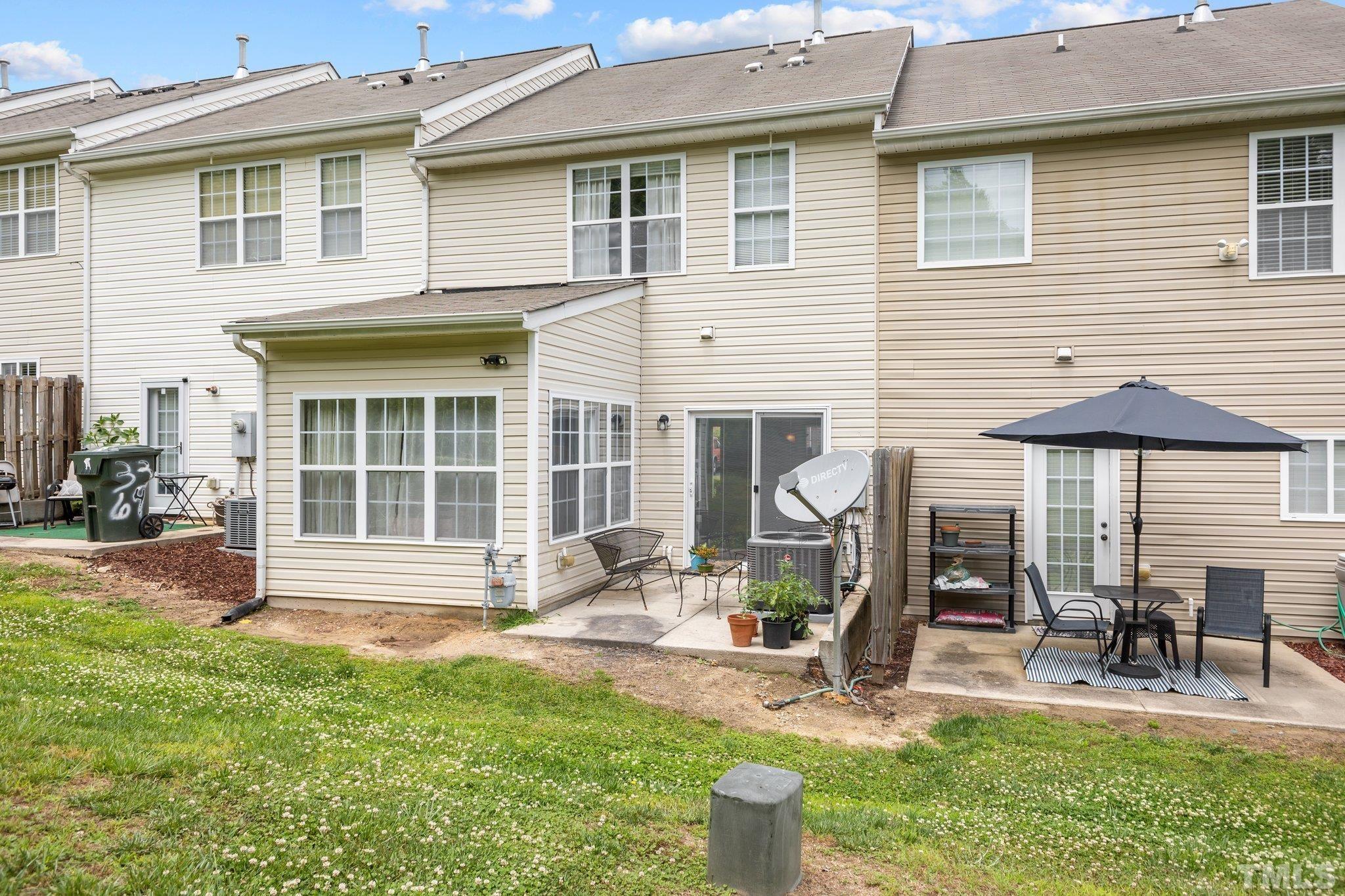 3366 Bridgeville Road Raleigh, NC 27610 - Photo 19 of 37 a front view of a house with a yard chairs and table