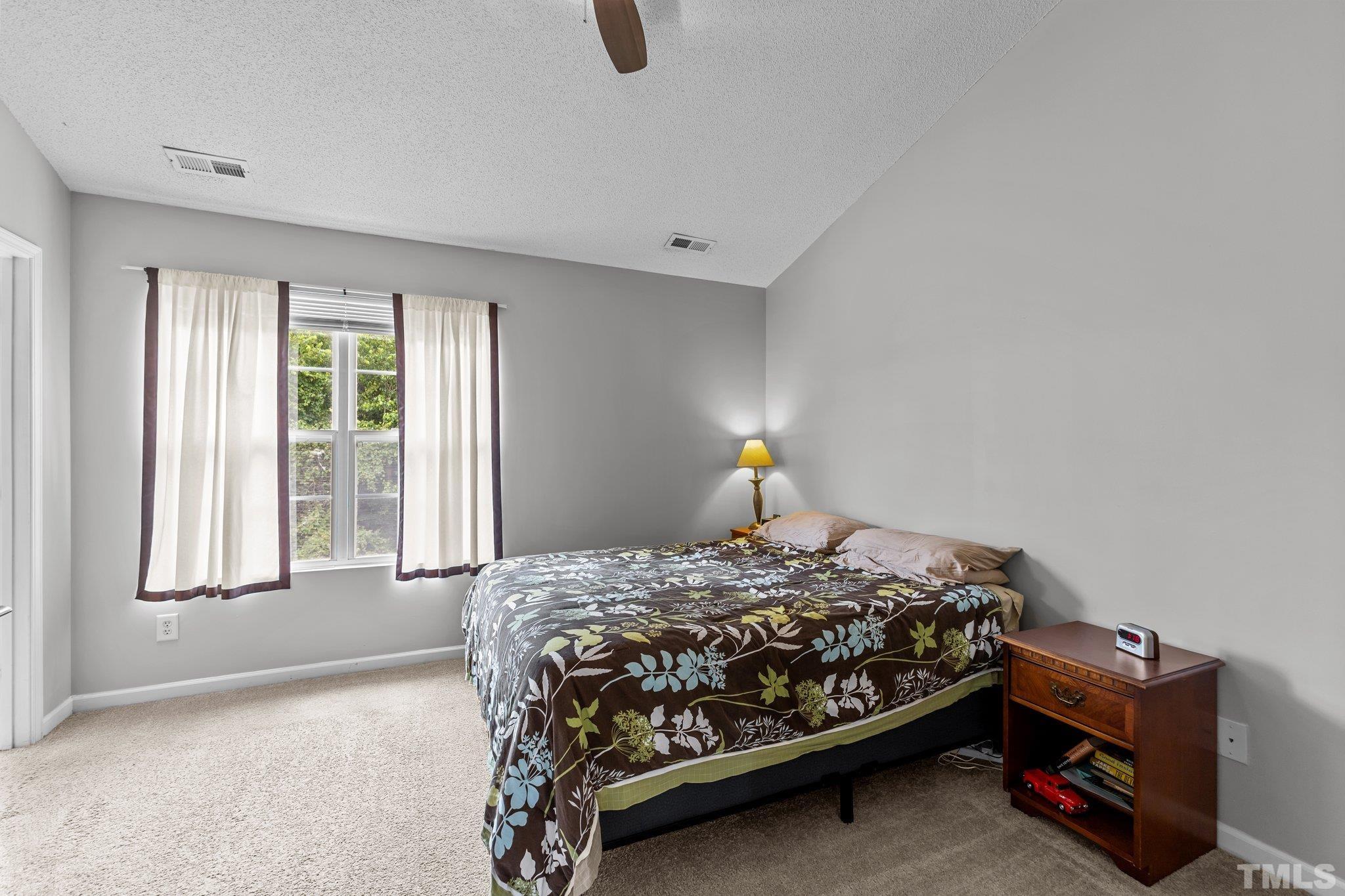 3366 Bridgeville Road Raleigh, NC 27610 - Photo 21 of 37 a bedroom with a bed a window and dresser