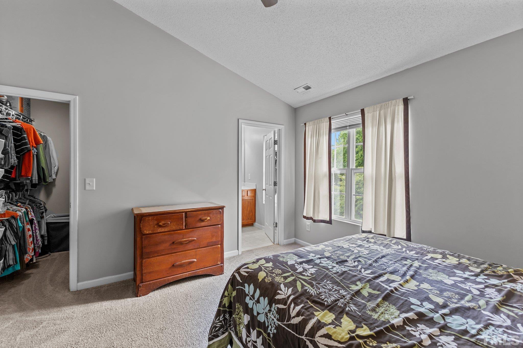 3366 Bridgeville Road Raleigh, NC 27610 - Photo 22 of 37 a bedroom with a bed and a tv