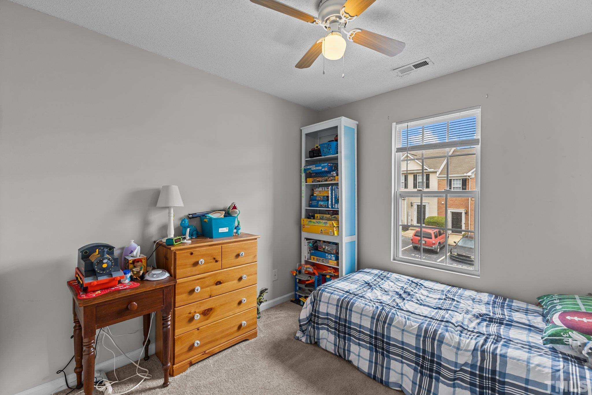 3366 Bridgeville Road Raleigh, NC 27610 - Photo 28 of 37 a bedroom with a bed and a window