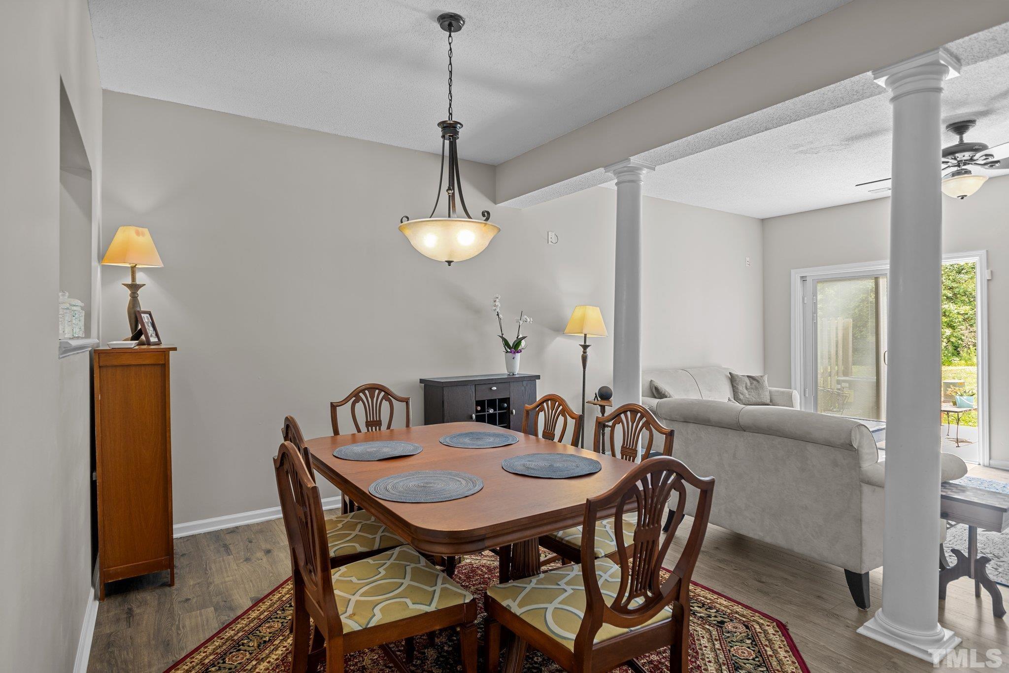 3366 Bridgeville Road Raleigh, NC 27610 - Photo 8 of 37 a view of a dining room with furniture and wooden floor