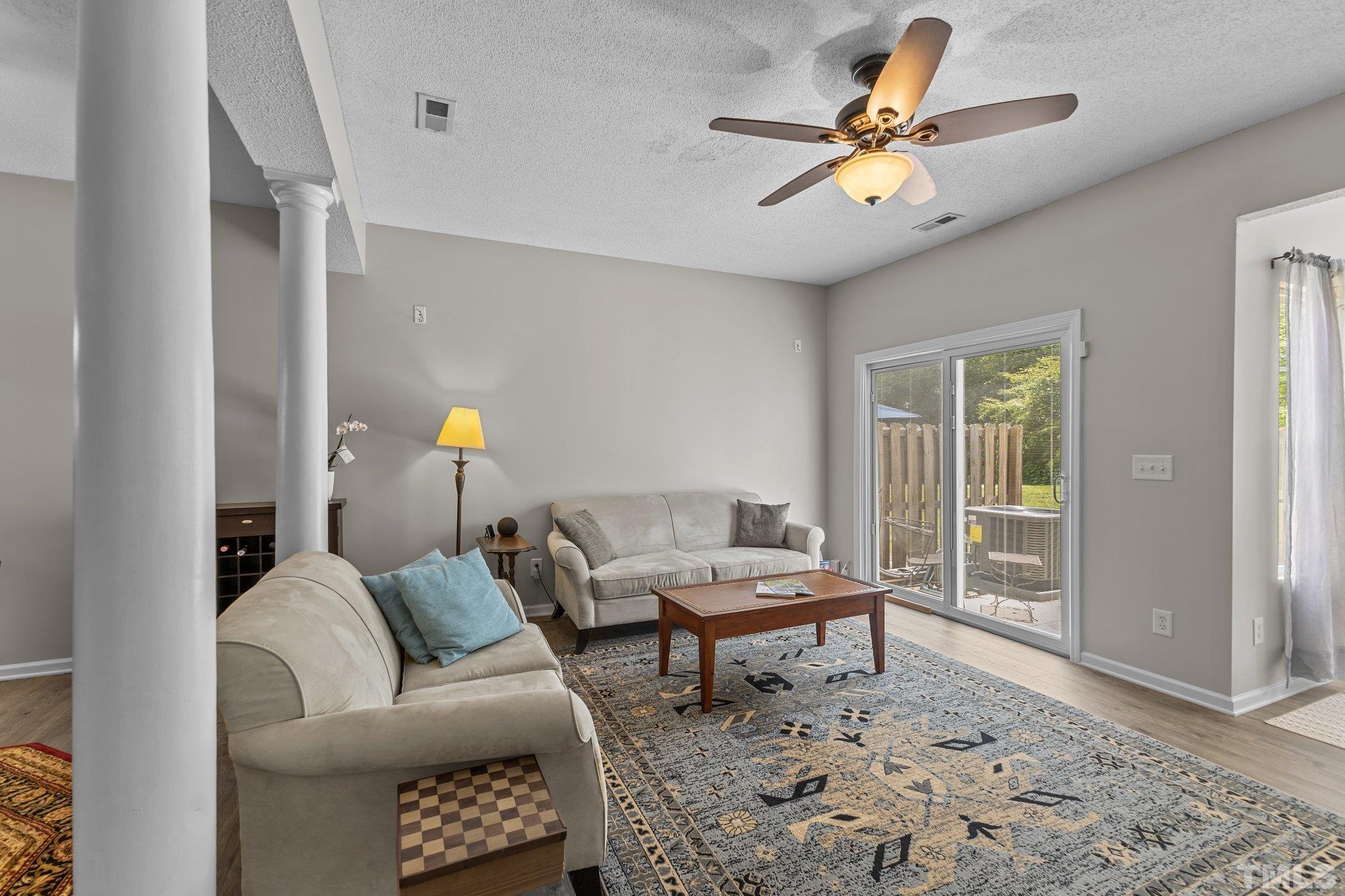 3366 Bridgeville Road Raleigh, NC 27610 - Photo 9 of 37 a living room with furniture and a window