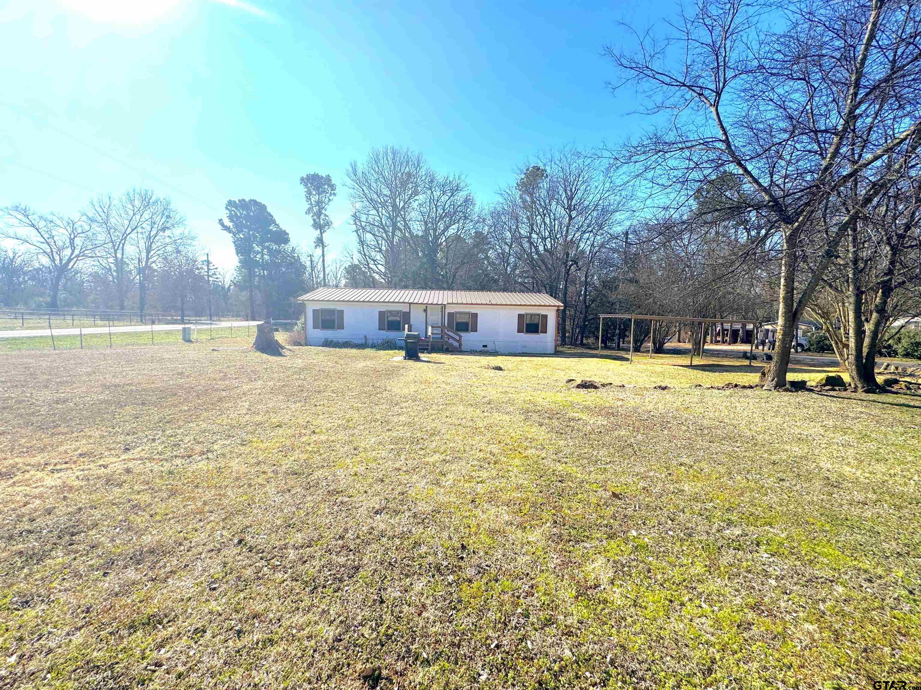 1391 San Saba Road Mount Vernon, TX 75457 - Photo 1 of 13 a view of a swimming pool with an outdoor space and seating area
