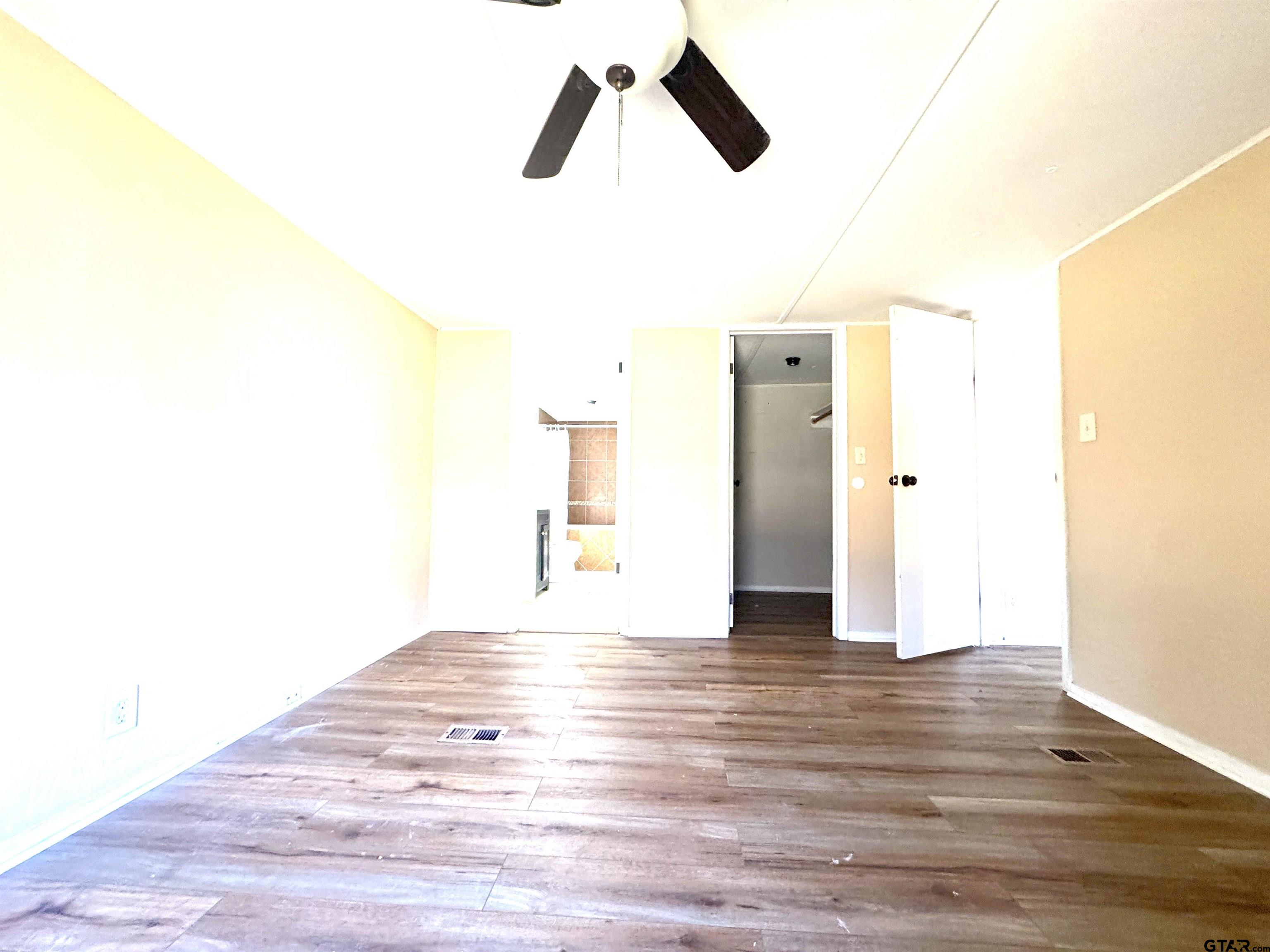 1391 San Saba Road Mount Vernon, TX 75457 - Photo 8 of 13 a view of empty room with wooden floor