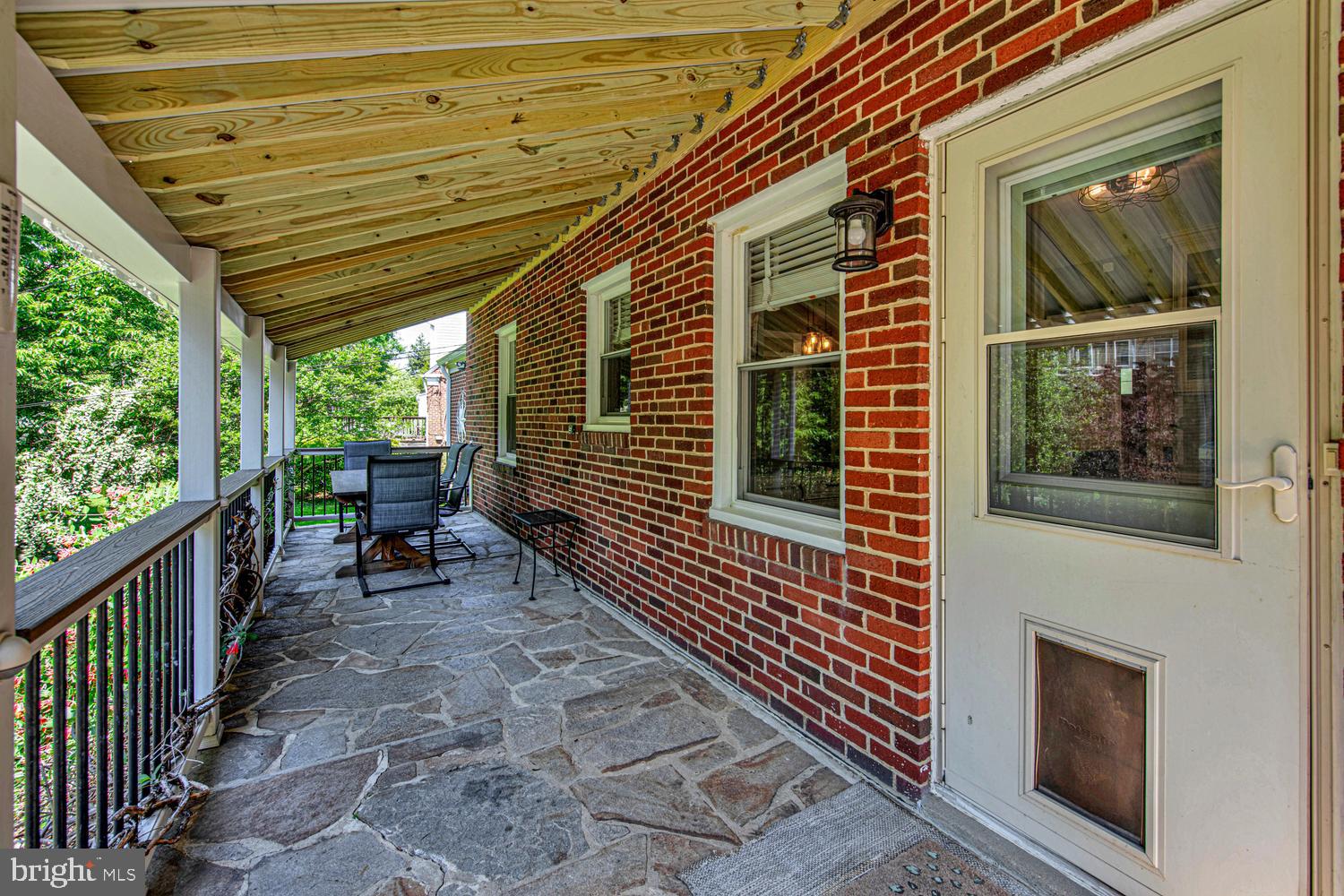 902 Locustvale Road Towson, MD 21204 - Photo 29 of 35 a view of a porch with furniture and floor to ceiling window