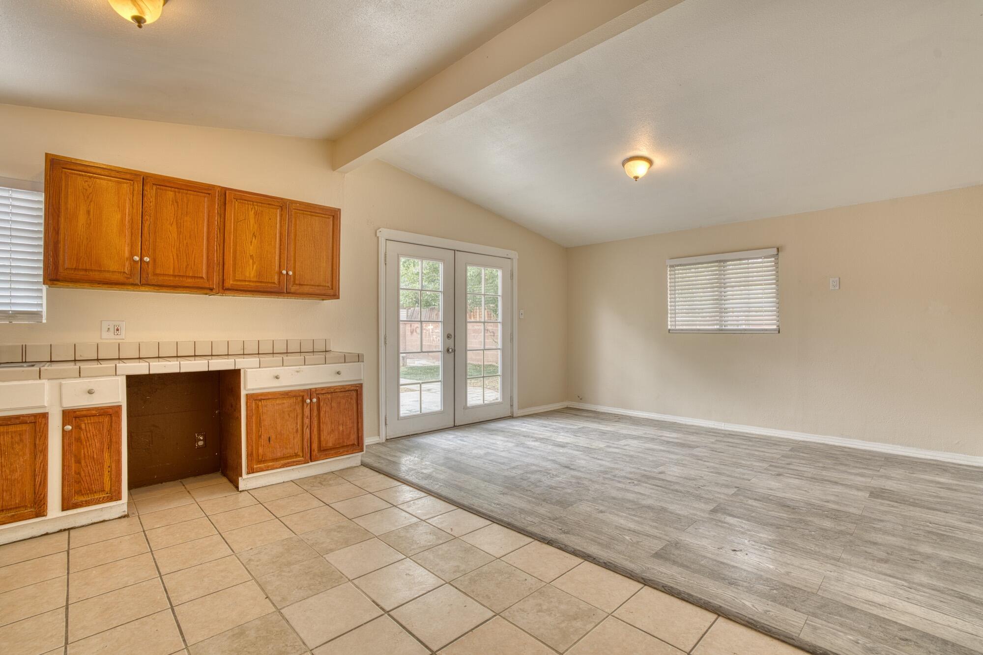 2047 West Lingard Street Lancaster, CA 93536 - Photo 1 of 15 a view of an empty room with a fireplace and a window