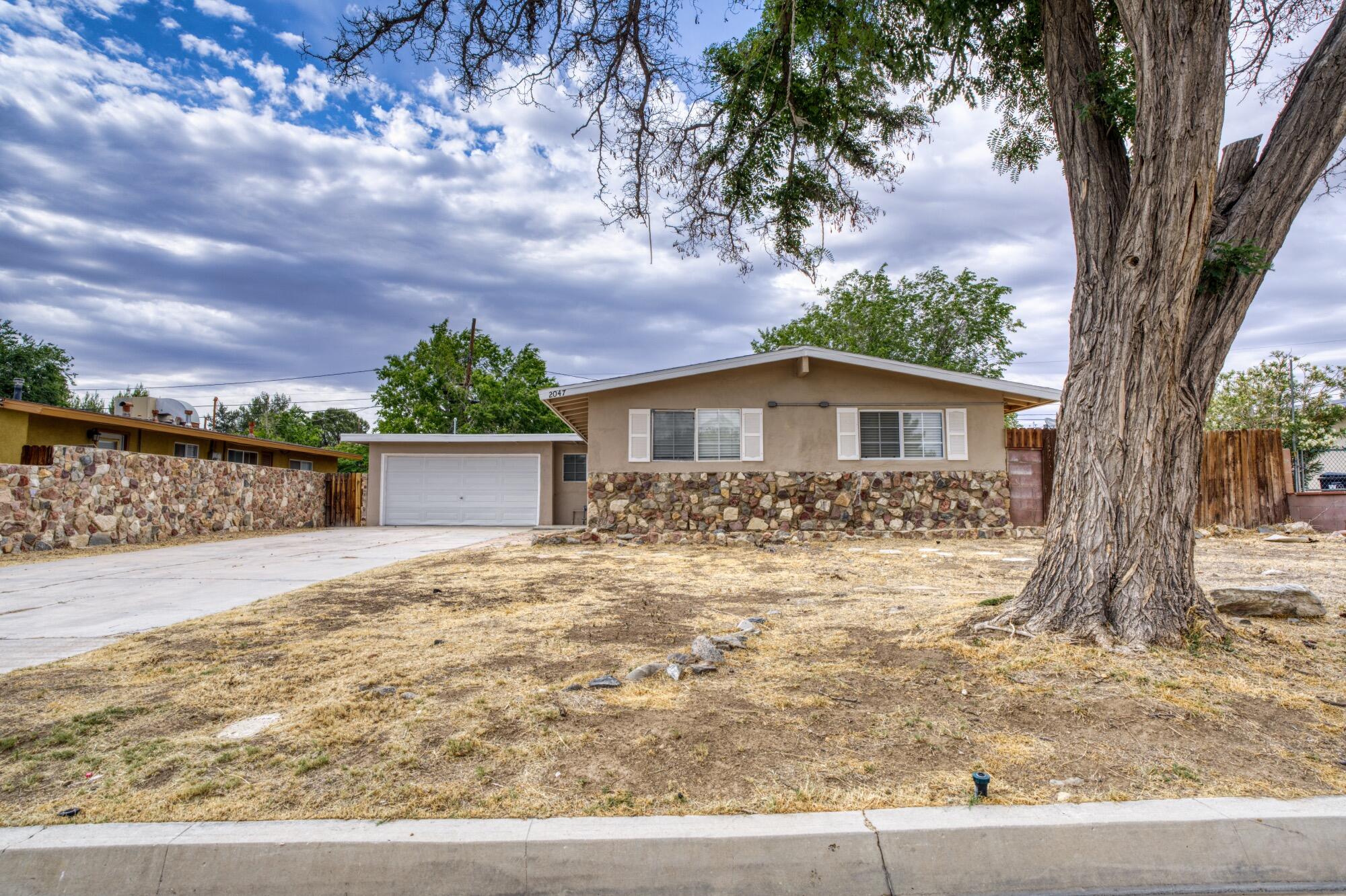 2047 West Lingard Street Lancaster, CA 93536 - Photo 14 of 15 front view of a house with a yard