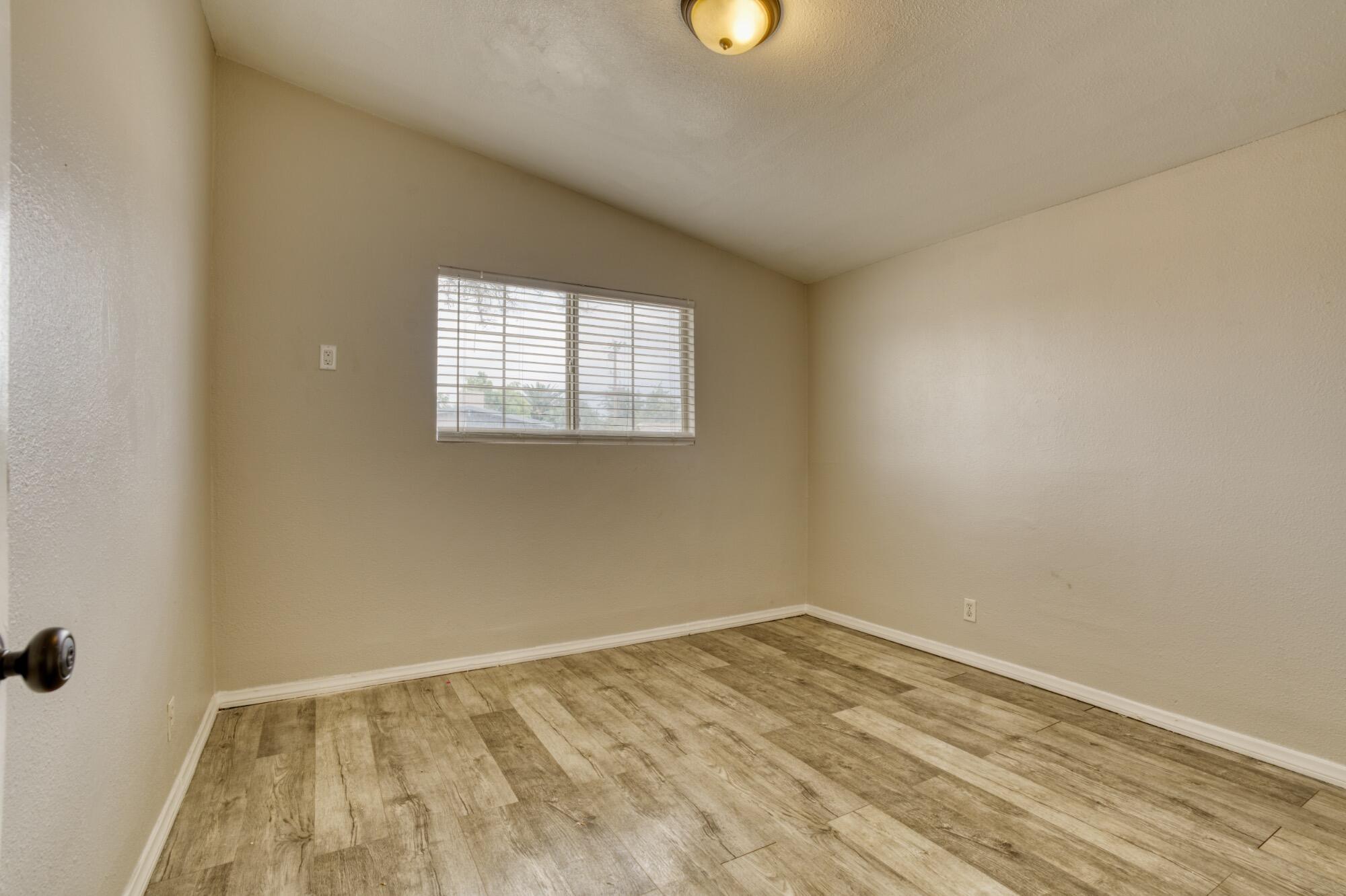 2047 West Lingard Street Lancaster, CA 93536 - Photo 3 of 15 an empty room with a window
