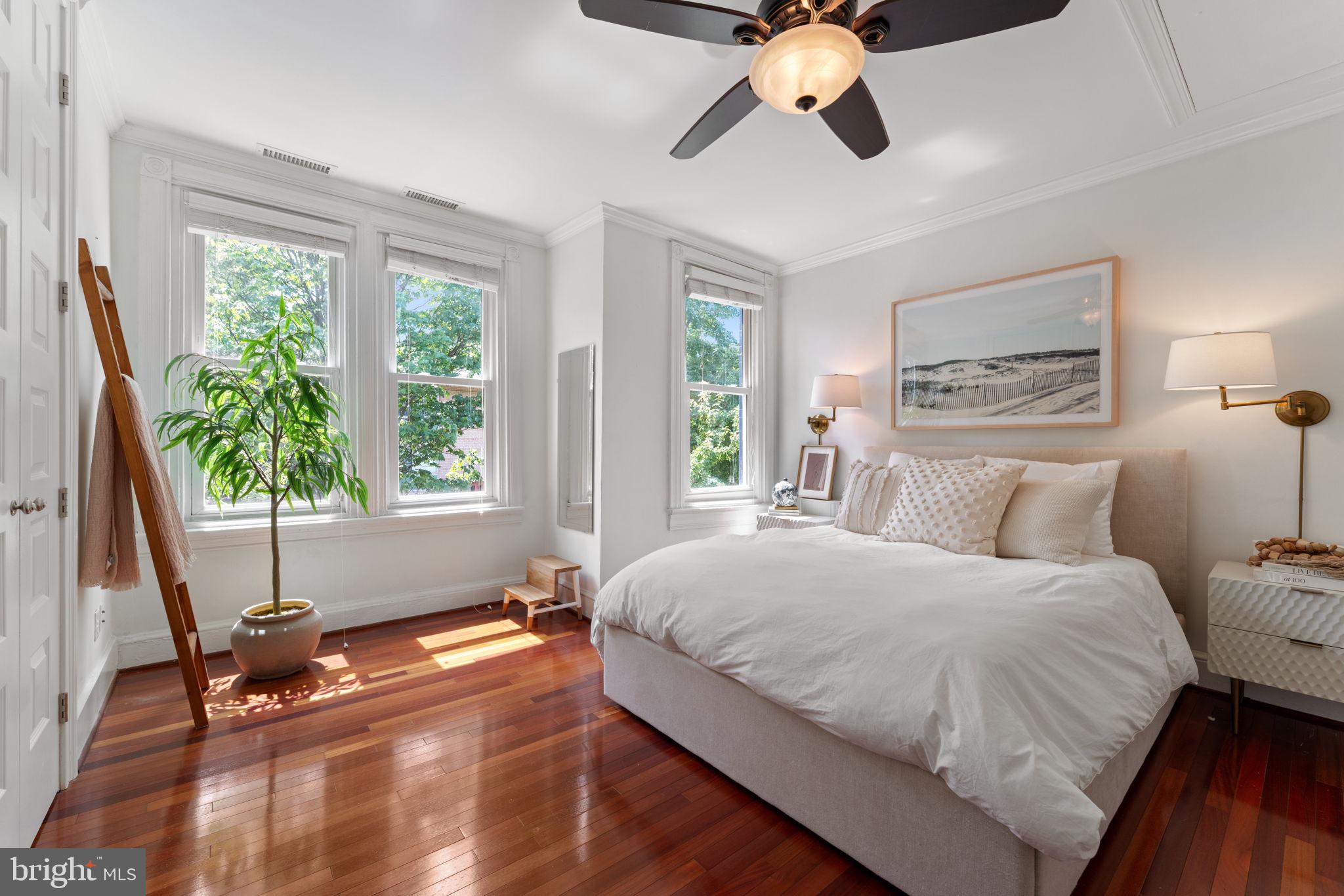 1314 C Street Southeast Washington, DC 20003 - Photo 15 of 30 a bedroom with a large bed and a chandelier