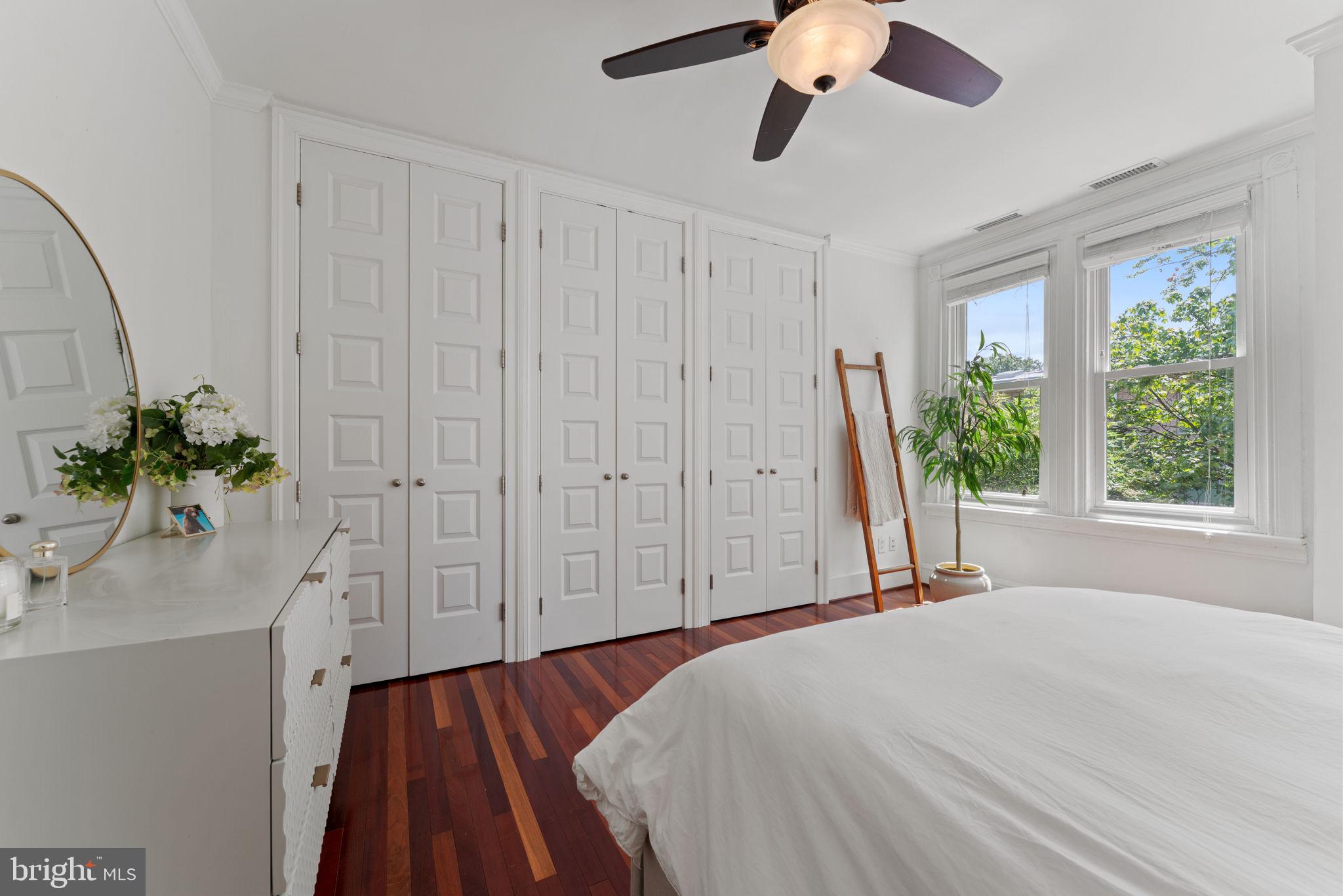 1314 C Street Southeast Washington, DC 20003 - Photo 16 of 30 a spacious bedroom with a bed and a potted plant