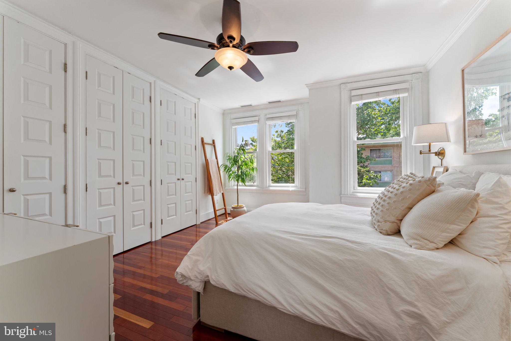 1314 C Street Southeast Washington, DC 20003 - Photo 17 of 30 a bedroom with a bed a window and a ceiling fan