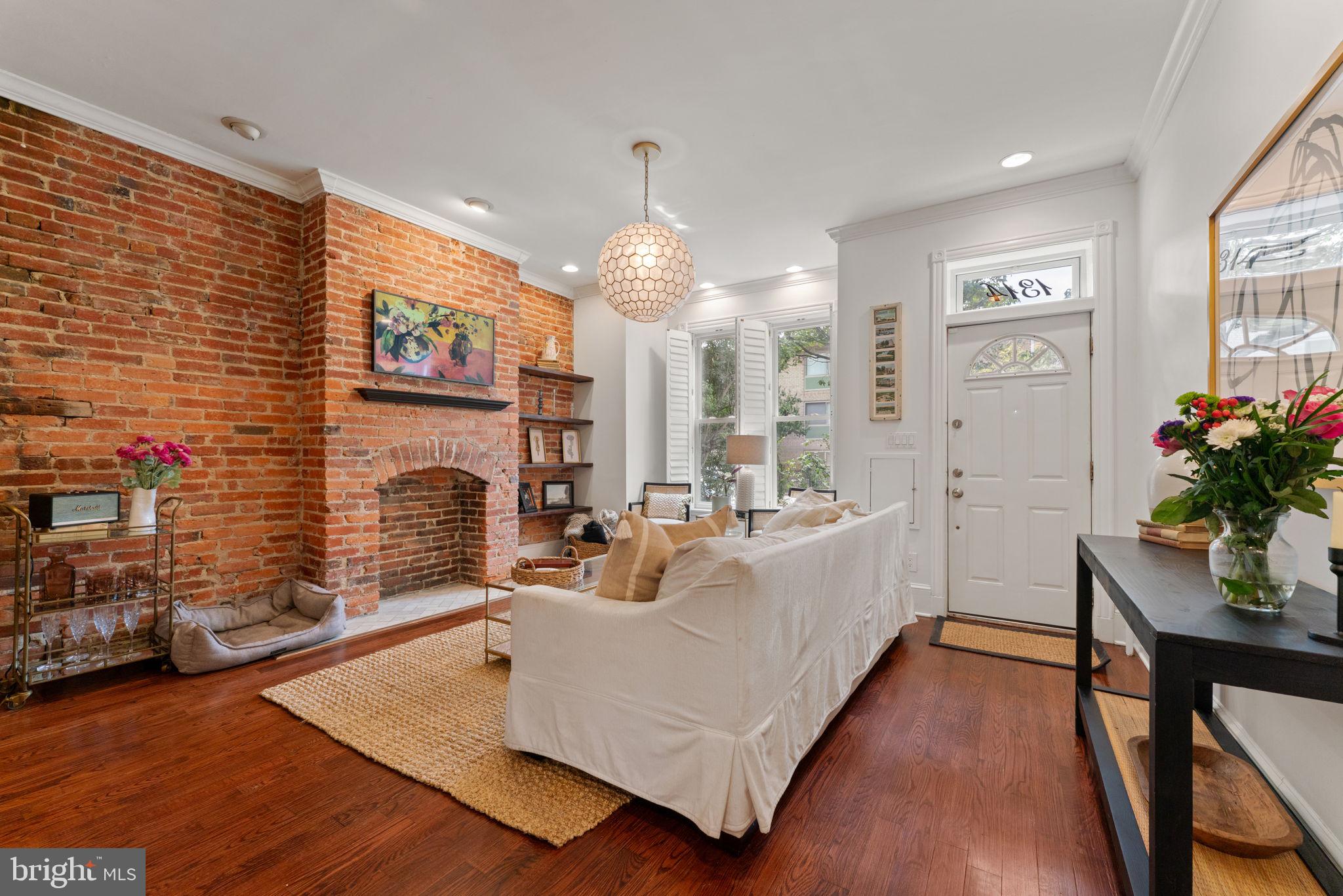 1314 C Street Southeast Washington, DC 20003 - Photo 2 of 30 a living room with furniture fireplace and flat screen tv