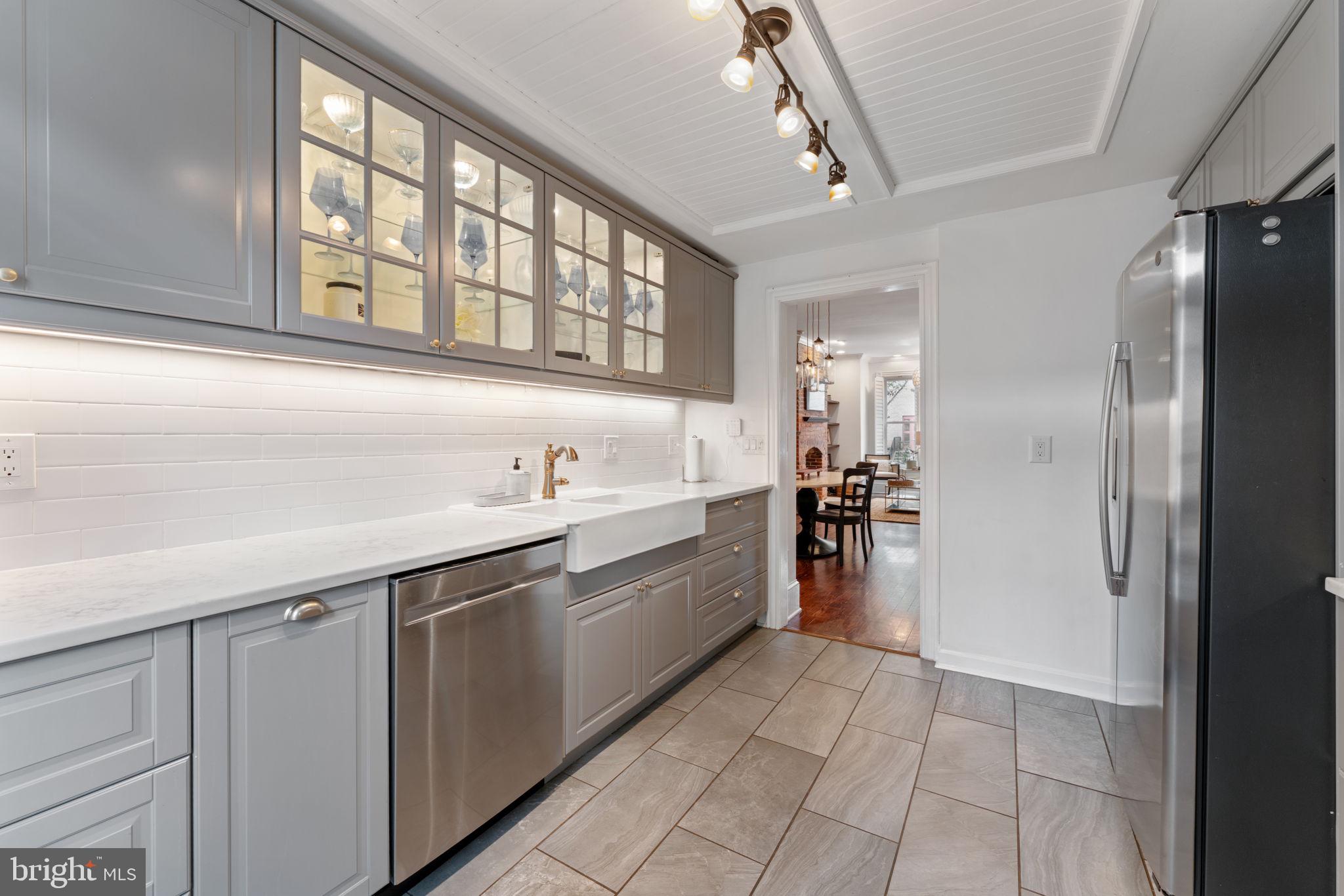 1314 C Street Southeast Washington, DC 20003 - Photo 8 of 30 a large kitchen with a lot of counter space and a sink