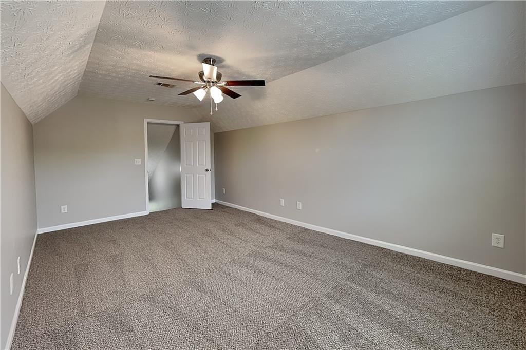 6345 Aarons Way Flowery Branch, GA 30542 - Photo 16 of 19 a view of a big room with carpet