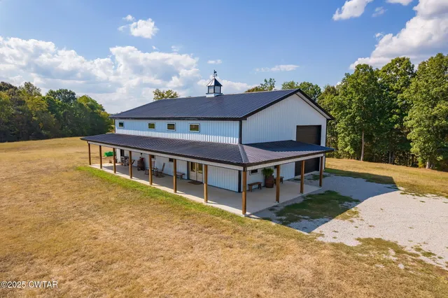 a view of a house with roof deck front of house