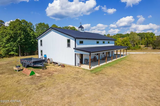 a view of a lake with houses in the back