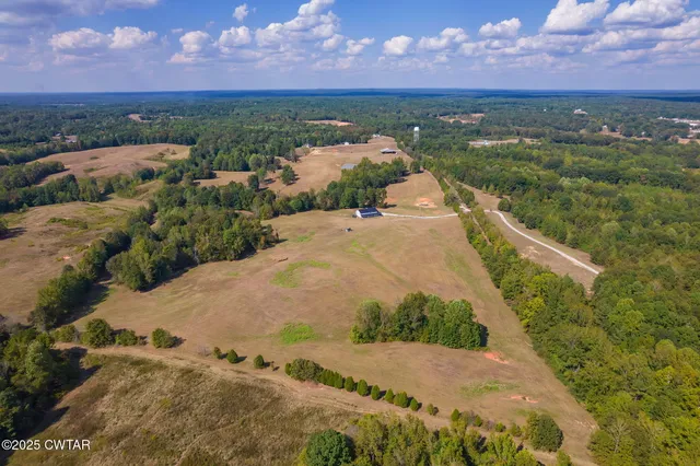 a view of a lake in front of the house