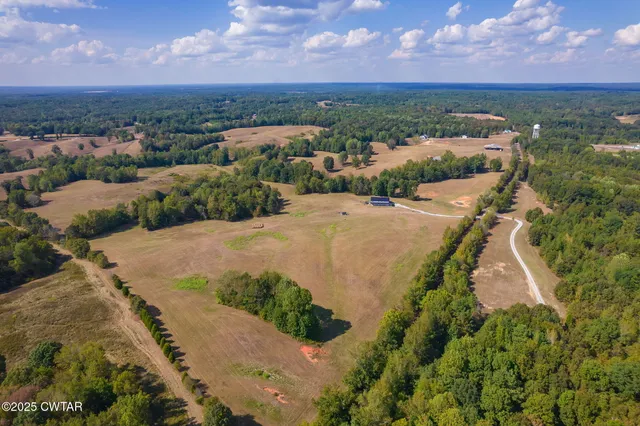 an aerial view of a house with a garden