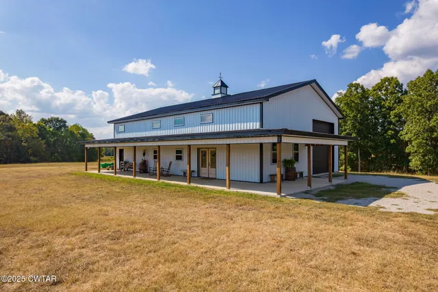 a view of a house with backyard and mountain view