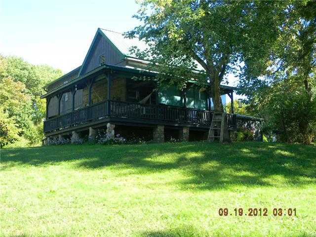 Rustic yet Charming Log Home on 6.3 Acres of privacy and seclusion!