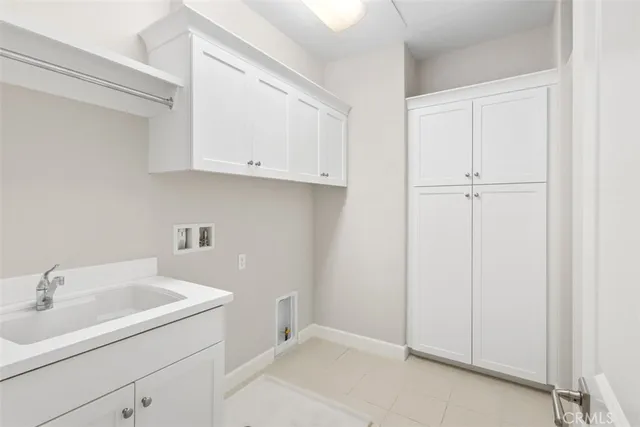 a bathroom with a sink and cabinets