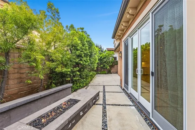 a view of a pathway both side of a house