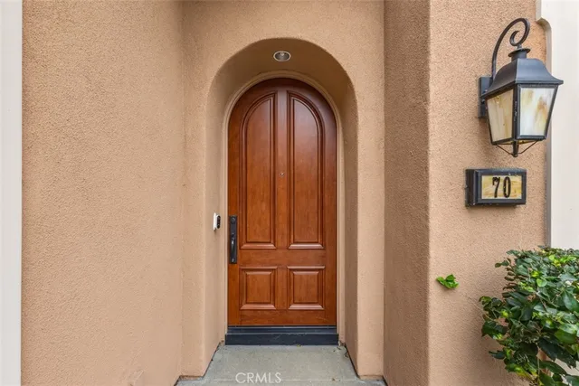 a view of an entryway with a mirror
