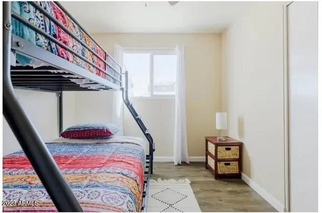 a bedroom with a bed and a window