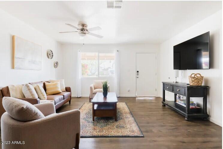 1048 West 12th Place Tempe, AZ 85281 - Photo 2 of 19 a living room with furniture and a flat screen tv