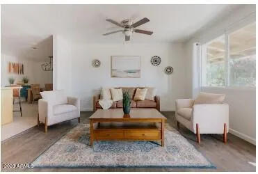 a living room with furniture and a rug