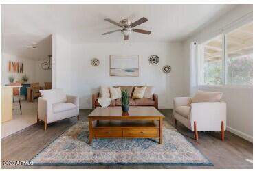1048 West 12th Place Tempe, AZ 85281 - Photo 3 of 19 a living room with furniture and a rug