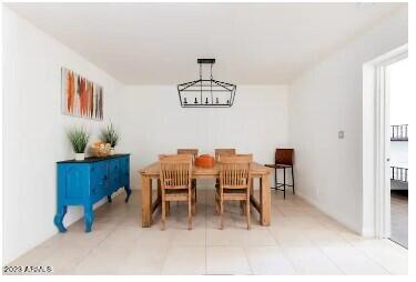 1048 West 12th Place Tempe, AZ 85281 - Photo 10 of 19 a dining room with furniture a chandelier and a rug