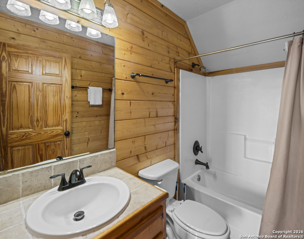 360 Bluebonnet Concan, TX 78838 - Photo 22 of 40 a bathroom with a sink toilet and shower