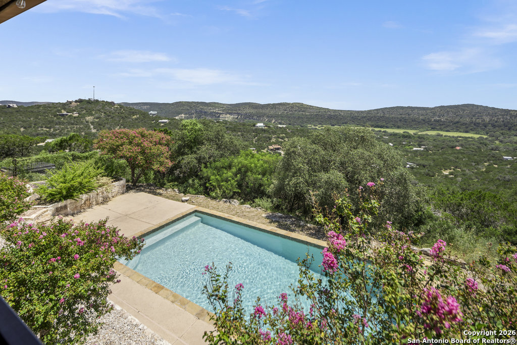 360 Bluebonnet Concan, TX 78838 - Photo 31 of 40 a view of a lake with a mountain in the background