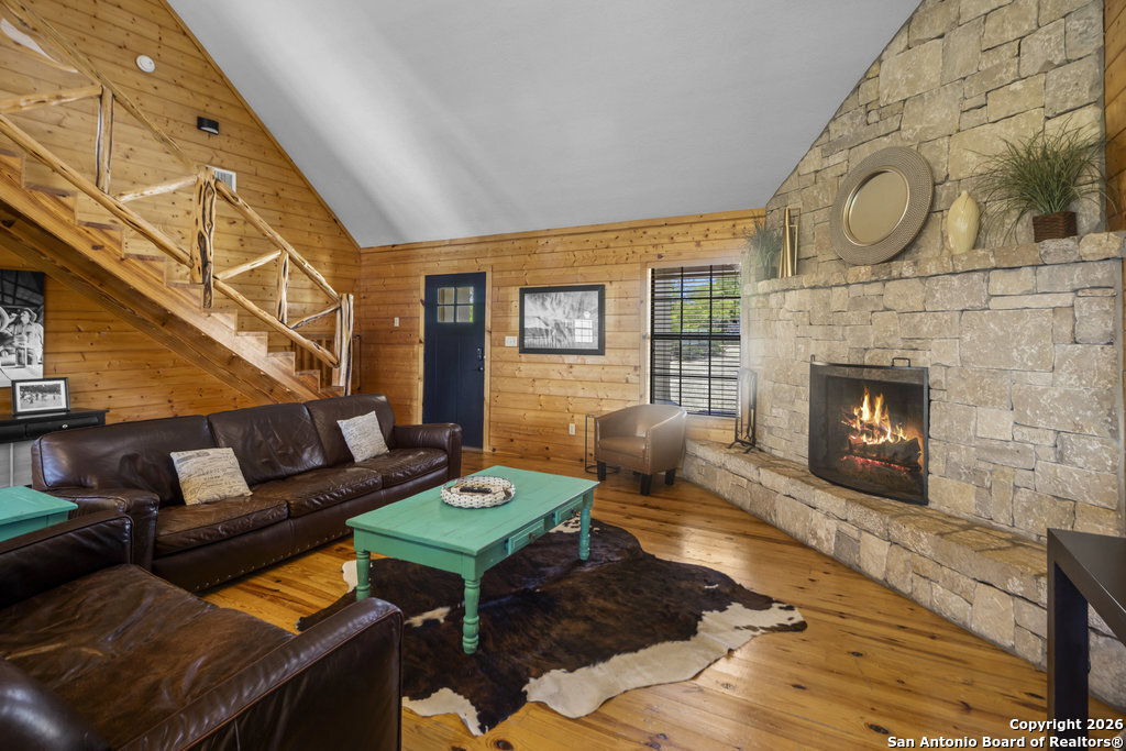 360 Bluebonnet Concan, TX 78838 - Photo 8 of 40 a living room with furniture and a fireplace