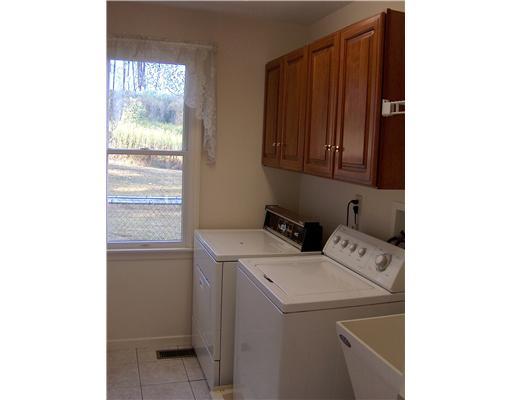 42 Gladden Road McDonald, PA 15057 - Photo 8 of 18 Other. Laundry room with utility sink. Cabinets for storing your laundry and cleaning supplies. Ceramic tile flooring.