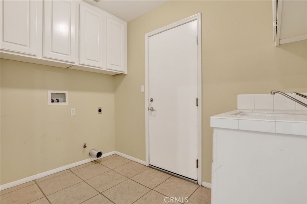 20543 Pesaro Porter Ranch Porter Ranch, CA 91326 - Photo 59 of 67 a view of storage and utility room with washer and dryer