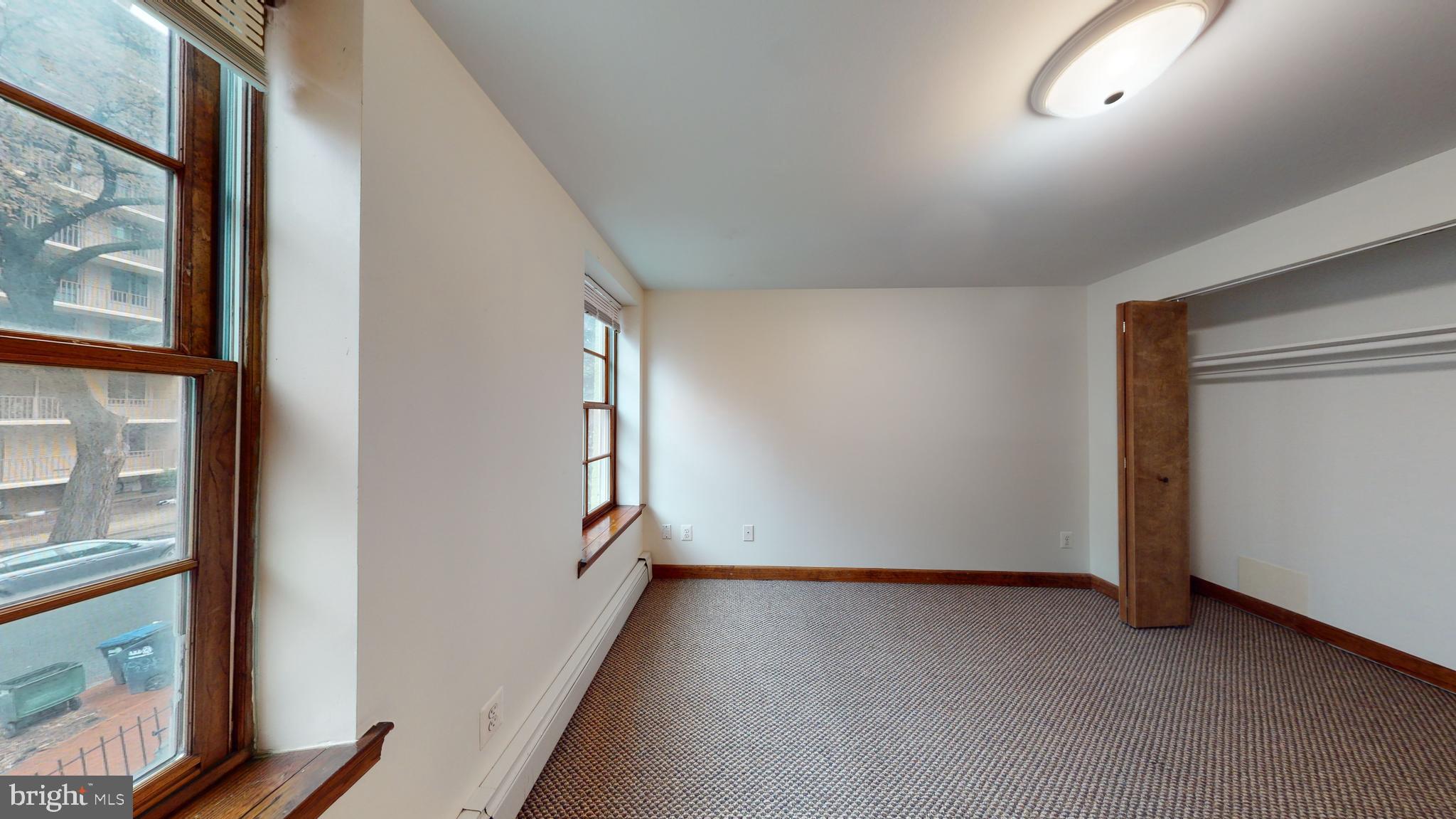 1008 23rd Street Northwest Washington, DC 20037 - Photo 11 of 18 a view of a room with wooden floor and windows