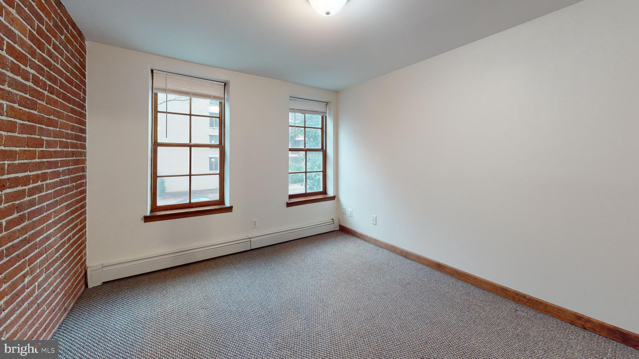 1008 23rd Street Northwest Washington, DC 20037 - Photo 12 of 18 an empty room with windows