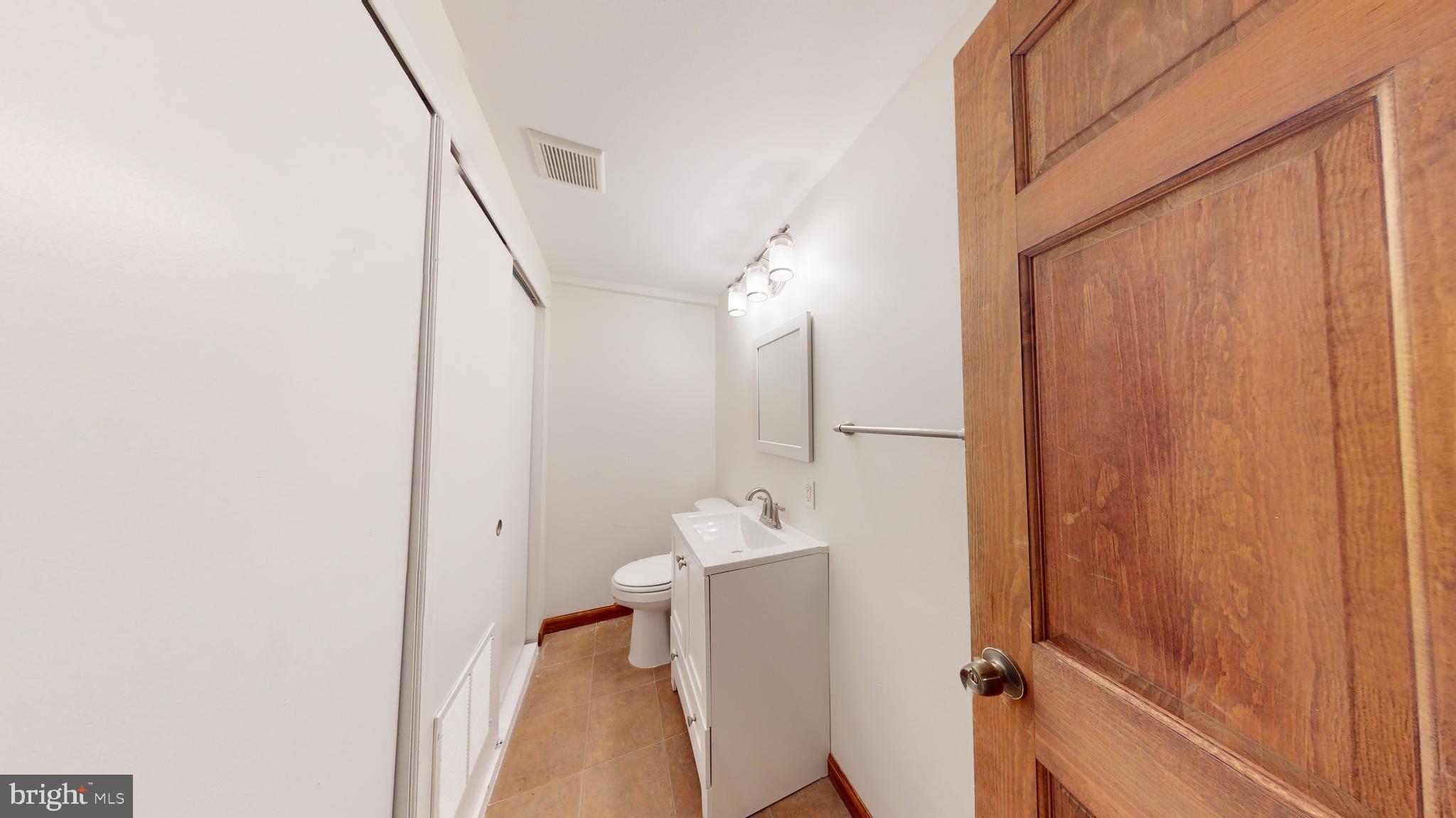 1008 23rd Street Northwest Washington, DC 20037 - Photo 15 of 18 a bathroom with a sink and a mirror