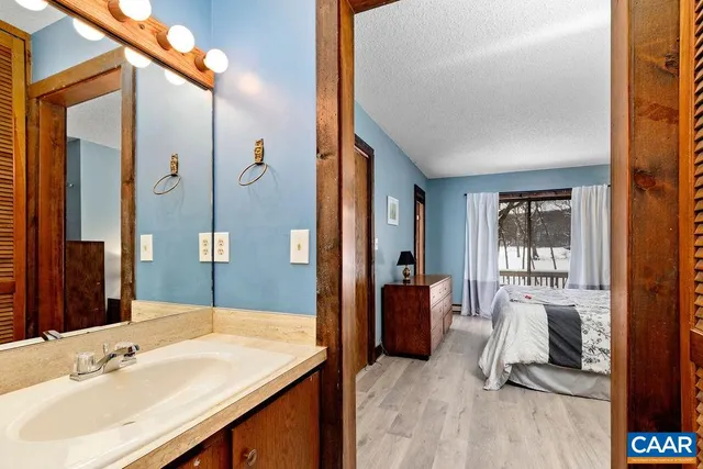 a bathroom with a sink a vanity and a mirror