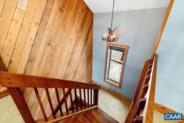 a bedroom with two beds and a large window